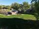 An expansive backyard featuring lush green grass and a charming house with a cozy back porch at 1402 Hornaday Rd, Brownsburg, IN 46112