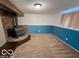 Unfurnished basement area with fireplace, providing a canvas for customization and future expansion at 1402 Hornaday Rd, Brownsburg, IN 46112