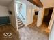 Basement featuring carpeted staircase, offering easy access and a welcoming transition to other spaces at 1402 Hornaday Rd, Brownsburg, IN 46112