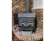 Close up of an energy efficient Timberline wood burning fireplace with a metal bucket at 1402 Hornaday Rd, Brownsburg, IN 46112