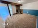 Unfurnished basement with fireplace and newer carpet, offering a versatile space for various purposes at 1402 Hornaday Rd, Brownsburg, IN 46112