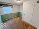 Bedroom featuring a single window, neutral carpet, and a two-tone paint scheme at 1402 Hornaday Rd, Brownsburg, IN 46112