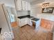 Well-lit kitchen features white cabinets, dark countertops, and a convenient workstation area at 1402 Hornaday Rd, Brownsburg, IN 46112