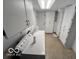 Bright laundry room featuring a washer, dryer, ample cabinets, and neutral-colored walls at 1402 Hornaday Rd, Brownsburg, IN 46112
