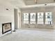 Spacious living room featuring four large windows and a fireplace, ready for customization at 1463 Crosstie Cir, Westfield, IN 46074