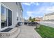 Backyard featuring a stone patio, dining furniture, and fire pit at 15152 Fallen Leaves Ln, Noblesville, IN 46060