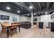 Finished basement with a cozy living area, dining space, exposed ceiling, and open layout at 15152 Fallen Leaves Ln, Noblesville, IN 46060