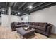 A large sectional sofa sits in a finished basement with an open ceiling at 15152 Fallen Leaves Ln, Noblesville, IN 46060