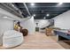 Finished basement with an arcade game, air hockey table, and basketball hoop game at 15152 Fallen Leaves Ln, Noblesville, IN 46060