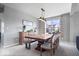 Elegant dining area with a wooden table, bench seating, and stylish decor at 15152 Fallen Leaves Ln, Noblesville, IN 46060