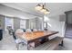 Open-concept dining area showcasing a large table, bench seating, and abundant natural light at 15152 Fallen Leaves Ln, Noblesville, IN 46060
