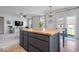 Bright kitchen featuring a central island with a butcher block top and modern lighting at 15152 Fallen Leaves Ln, Noblesville, IN 46060