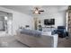 Open concept living room with large windows and comfortable seating and plush carpet at 15152 Fallen Leaves Ln, Noblesville, IN 46060
