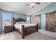 Serene bedroom featuring a king-size bed, ensuite bath, and modern barn door accents at 15152 Fallen Leaves Ln, Noblesville, IN 46060