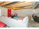 Relaxing basement area with comfortable seating, wood ceiling, and concrete walls at 15885 Symphony Blvd, Noblesville, IN 46060