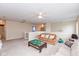 Bright bonus room with a ceiling fan, couches, and an open layout at 15885 Symphony Blvd, Noblesville, IN 46060