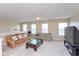 Large bonus room featuring two couches, multiple windows, and a ceiling fan at 15885 Symphony Blvd, Noblesville, IN 46060