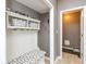 Functional mudroom area with a bench, storage baskets, and access to other rooms at 15885 Symphony Blvd, Noblesville, IN 46060