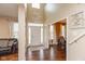 Welcoming two-story foyer with modern decor, hardwood floors, and an abundance of natural light at 15885 Symphony Blvd, Noblesville, IN 46060