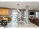 Bright kitchen with backyard access, stainless steel appliances, and a view into the living room at 15885 Symphony Blvd, Noblesville, IN 46060