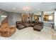 Spacious living room featuring a large sectional couch and neutral colored walls at 15885 Symphony Blvd, Noblesville, IN 46060
