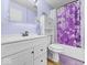 Bathroom with white cabinets and bathtub with shower features modern fixtures and vanity lighting at 1683 Sweetwater Ln, Greenfield, IN 46140