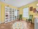 Sun-filled room with hardwood floors offers plenty of natural light and stylish built-in storage at 1683 Sweetwater Ln, Greenfield, IN 46140