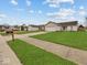 Charming one-story home featuring an attached garage and well-maintained front yard at 1683 Sweetwater Ln, Greenfield, IN 46140