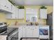 Efficient kitchen featuring white cabinets and countertops, and black appliances at 1683 Sweetwater Ln, Greenfield, IN 46140