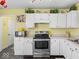 Cozy kitchen featuring white cabinets, stainless steel appliances, and stylish decor at 1683 Sweetwater Ln, Greenfield, IN 46140