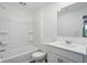 Pristine white bathroom featuring a shower-tub combo, modern vanity, and minimalist design at 16955 Cole Evans Dr, Noblesville, IN 46060
