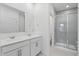 Modern bathroom with double sink vanity, tile floor, and glass-enclosed shower at 16955 Cole Evans Dr, Noblesville, IN 46060