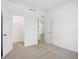 Bright bedroom features neutral carpet, closet and en-suite entrances, and crisp white walls at 16955 Cole Evans Dr, Noblesville, IN 46060