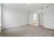 Bright, neutral bedroom showcases white walls, carpet, and view of bathroom at 16955 Cole Evans Dr, Noblesville, IN 46060