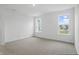 Bright bedroom with carpet and two windows letting in natural light at 16955 Cole Evans Dr, Noblesville, IN 46060