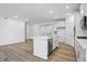Kitchen boasts a large island, stainless steel appliances, and a seamless transition to the living area at 16955 Cole Evans Dr, Noblesville, IN 46060