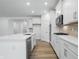 Spacious kitchen featuring white cabinets, quartz countertops, and stainless steel appliances at 16955 Cole Evans Dr, Noblesville, IN 46060