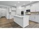 Well-lit kitchen with white cabinetry, an island with a sink, and stainless steel appliances at 16955 Cole Evans Dr, Noblesville, IN 46060