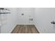 Bright laundry room boasts tile flooring and utility hookups for modern appliances at 16955 Cole Evans Dr, Noblesville, IN 46060