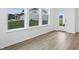 Bright living room with hardwood floors and a view to the exterior through a large window at 16955 Cole Evans Dr, Noblesville, IN 46060