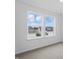 Window view of nearby homes from room with neutral carpet and white walls at 16955 Cole Evans Dr, Noblesville, IN 46060