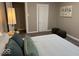 Bedroom featuring a full bed, accent pillows, carpet, and warm lighting fixtures at 2406 E 10Th St, Anderson, IN 46012