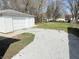 View of the detached garage and yard at 2406 E 10Th St, Anderson, IN 46012