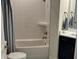 Bathroom featuring a white tub with shower and striped curtain at 2460 Collins Dr, Westfield, IN 46074