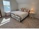Bedroom featuring natural light, decorative pillows, and a side table at 2460 Collins Dr, Westfield, IN 46074