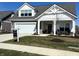 Charming single-Gathering home with a well-manicured lawn, and a welcoming front porch at 2460 Collins Dr, Westfield, IN 46074