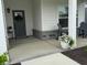 Charming front porch featuring stylish decor, plants and comfortable seating area at 2460 Collins Dr, Westfield, IN 46074