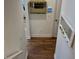 Hallway with hardwood flooring and decorative mirrors at 2460 Collins Dr, Westfield, IN 46074