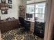 Home office featuring desk, chair, shelving, and a large window at 2460 Collins Dr, Westfield, IN 46074