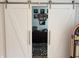 View of home office through white sliding doors and geometric rug at 2460 Collins Dr, Westfield, IN 46074